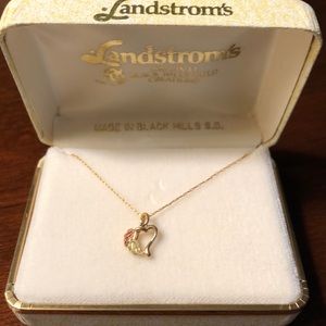 Delicate gold pendant.